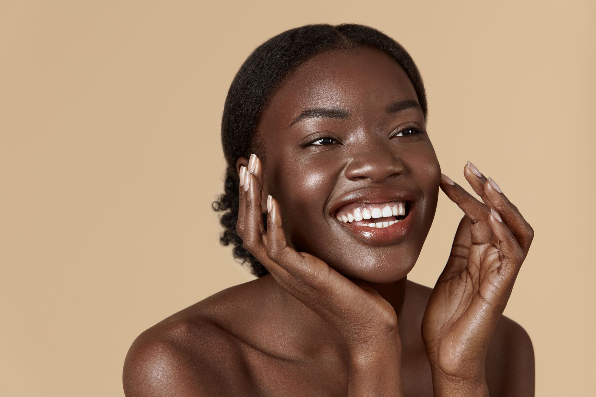 Smiling client with glowing, even-toned skin